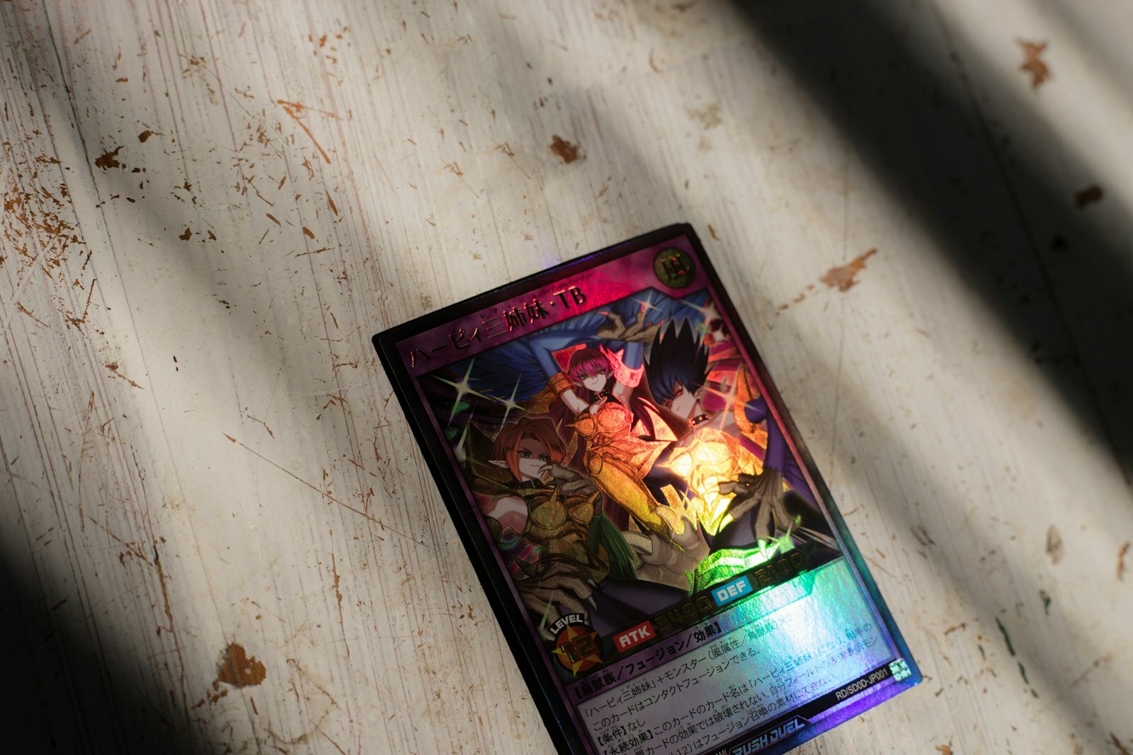 A yu-gi-oh! card is resting on wood