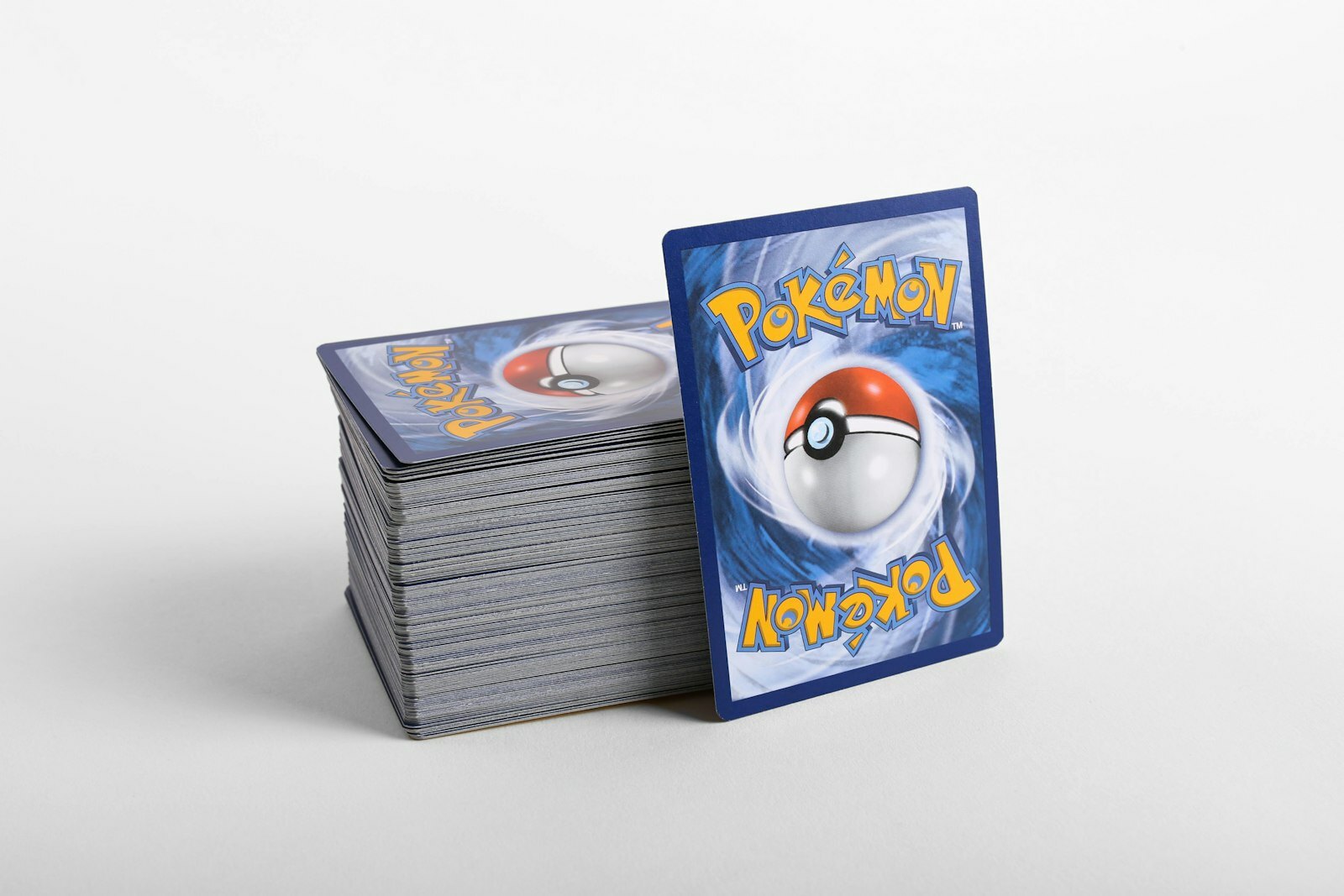 a stack of pokemon cards sitting on top of each other